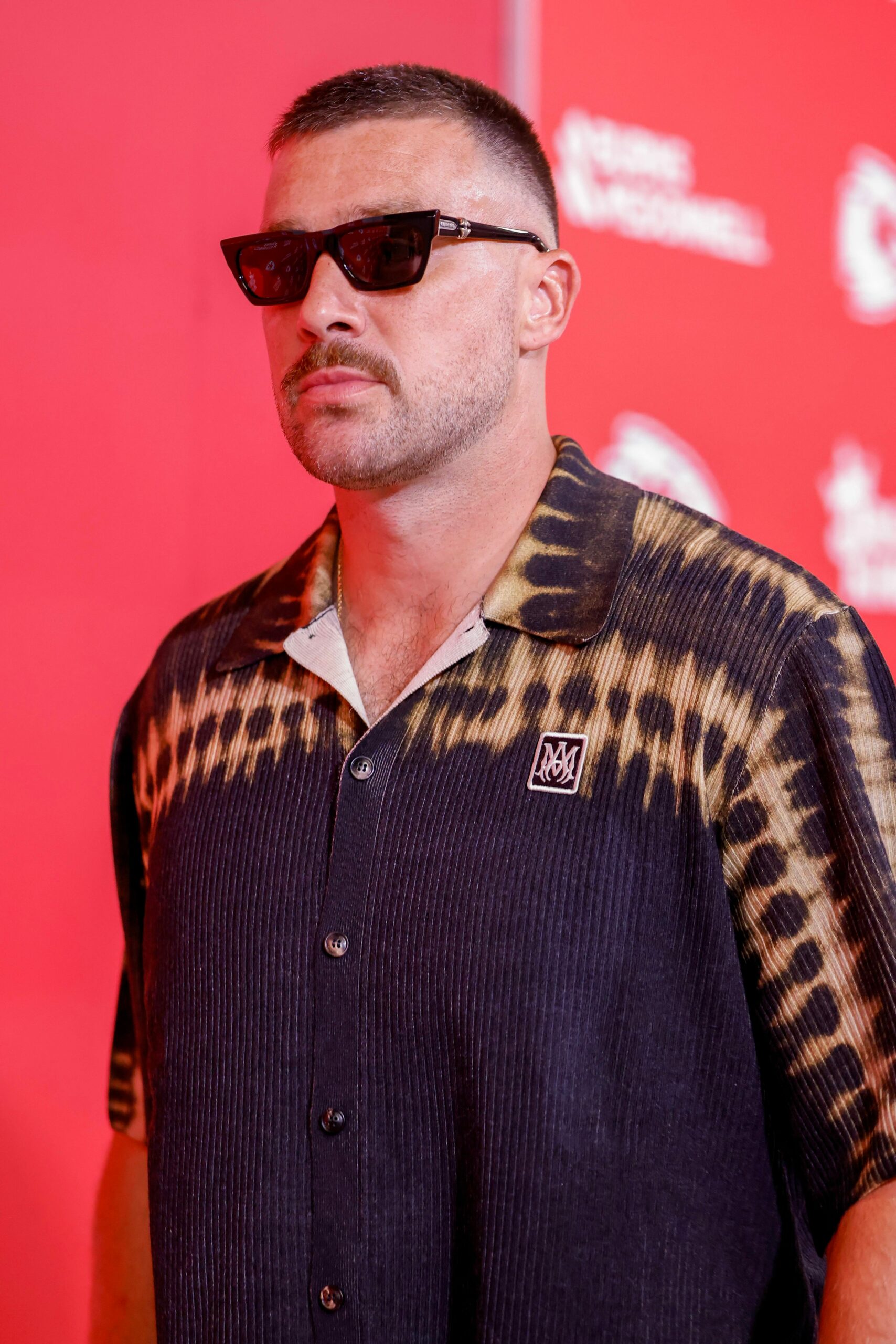 Travis Kelce’s Bold Wedding Band and Tie-Dye Amiri Look at Preseason Game Is Turning Heads—Here’s What It Means for Style and Confidence