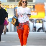 Unlock Jennifer Lawrence’s Effortless Style Hack: How She Turns a Simple Flannel and Kelly Bag Into a Game-Changing Look You Need to Try Now!